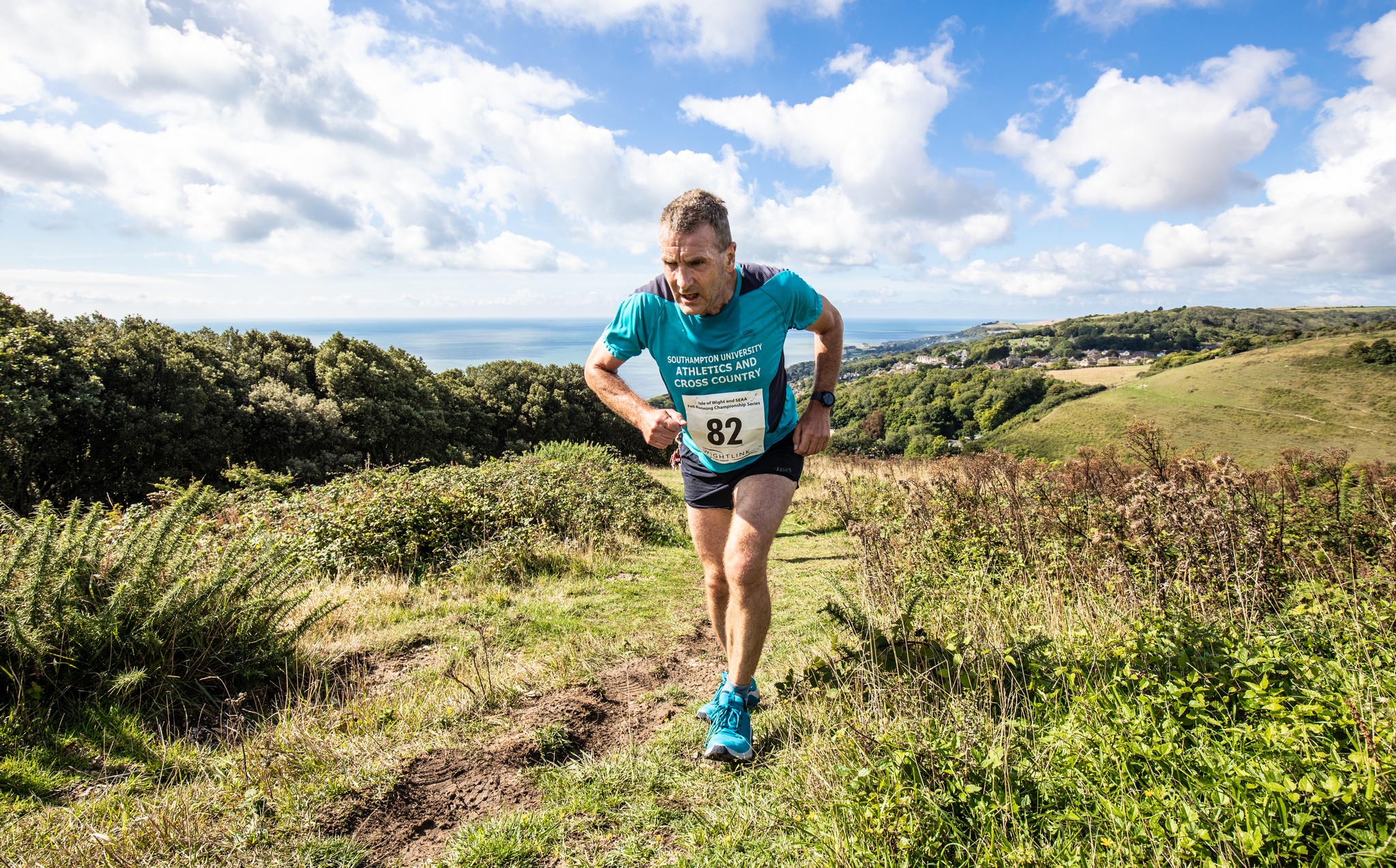 Peter running up a hill.